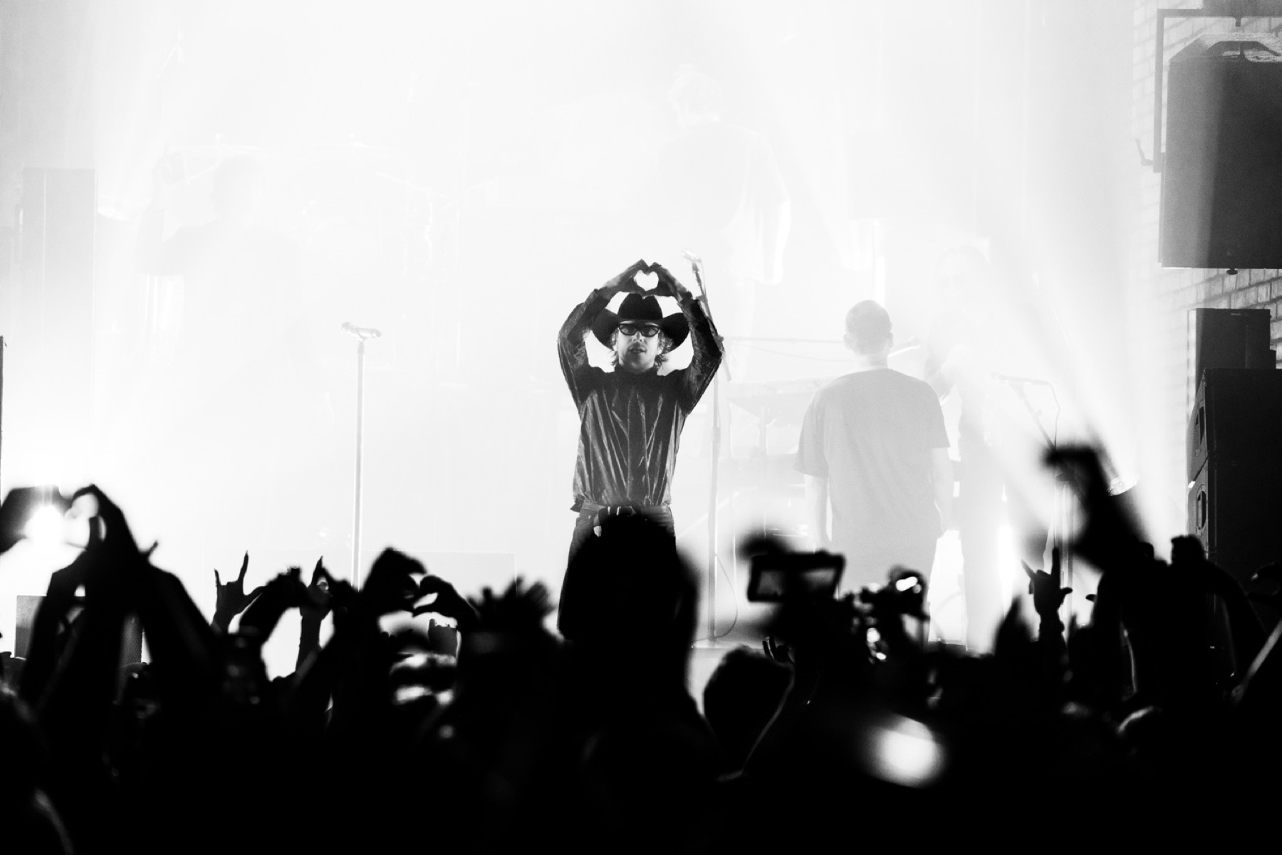 Cage the Elephant at rocknite CMA Fest 2026 — Matt Schultz with heart-hands on a smoky stage